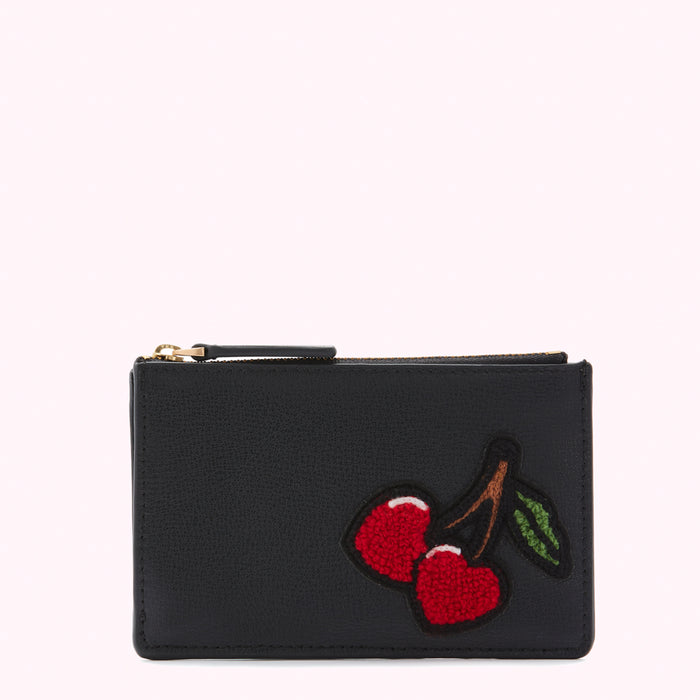 Black leather zip pouch with red cherry embroidery against a white background.