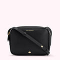 Black Lulu Guinness crossbody bag with gold-tone hardware and a small lip detail.
