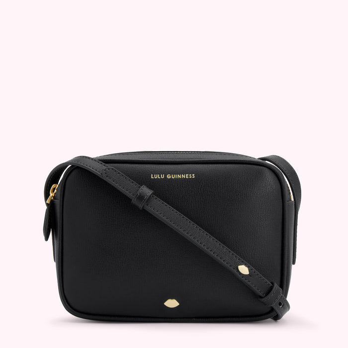 Black Lulu Guinness crossbody bag with gold-tone hardware and a small lip detail.