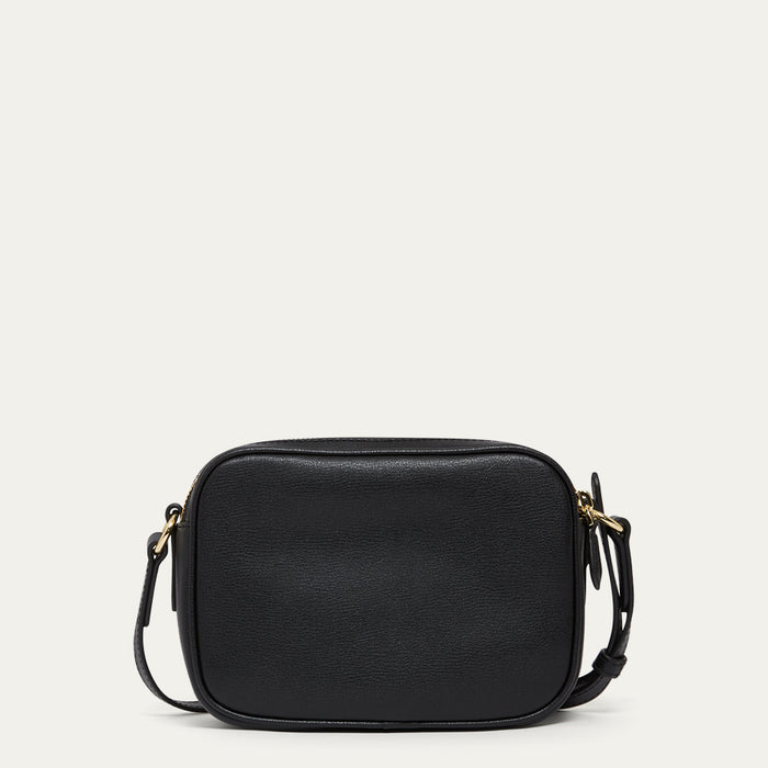 Black leather crossbody bag on a light gray background