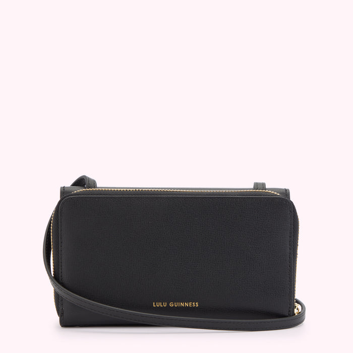 Back image of a black leather crossbody bag with a gold metal zipper and gold foil 'Lulu Guinness' logo on the back.