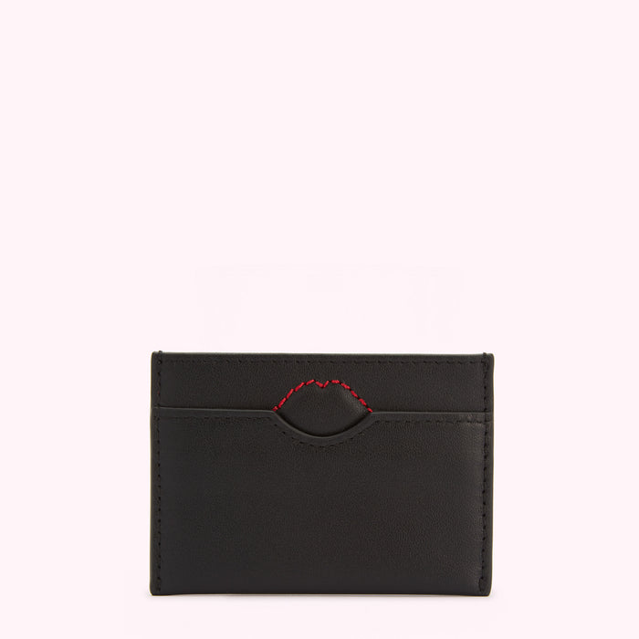 Black leather cardholder with a red lip-shaped detail.