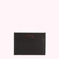 Black leather cardholder with a red lip-shaped detail.