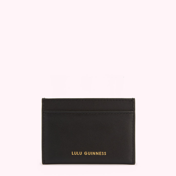 Black leather cardholder with gold Lulu Guinness logo on a white background.