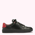 Black leather sneaker with red accent on a white background.