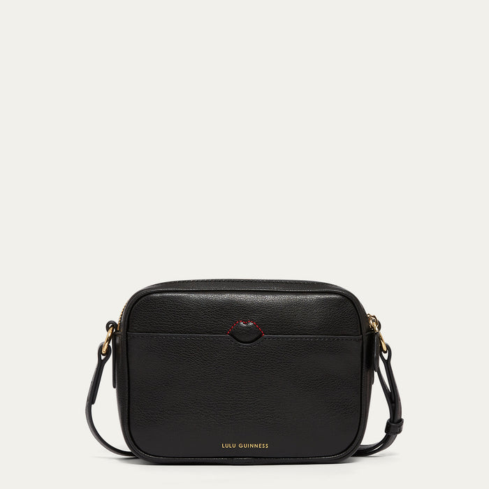 Black handbag with gold accents, red stitching and gold Lulu Guinness logo on a white background