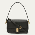 A black pebbled leather shoulder bag with a flap front, gold-tone turn-lock closure, and adjustable shoulder strap, shown on a light gray background.
