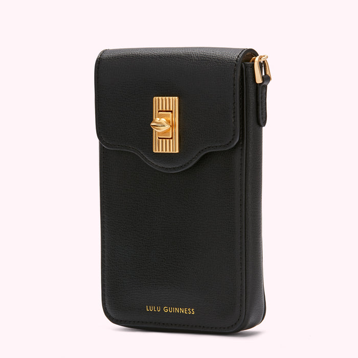 Black Lulu Guinness crossbody phone bag with gold clasp.