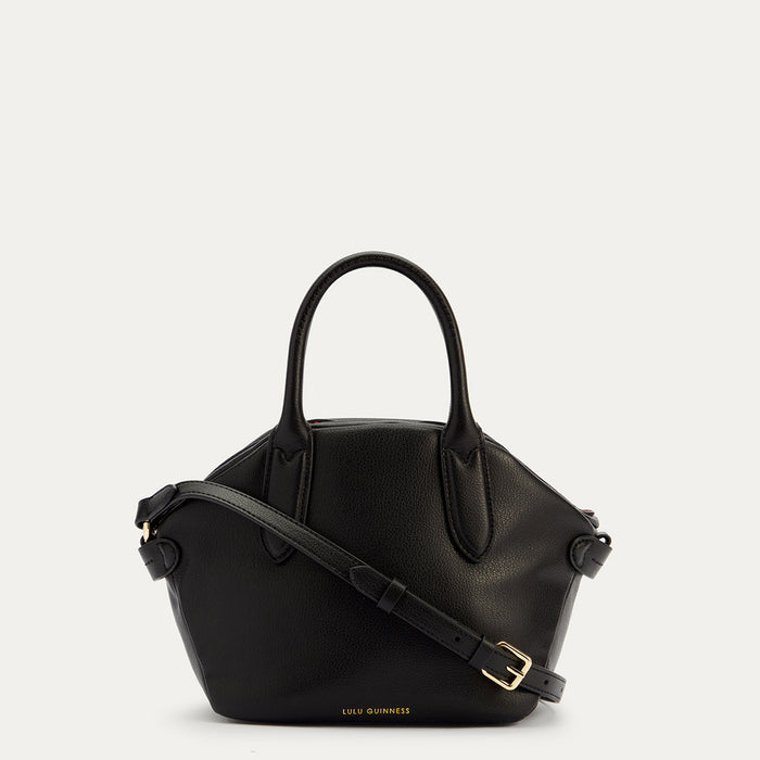 A front image of a black leather handbag with a top handle and a gold foil Lulu Guinness logo.