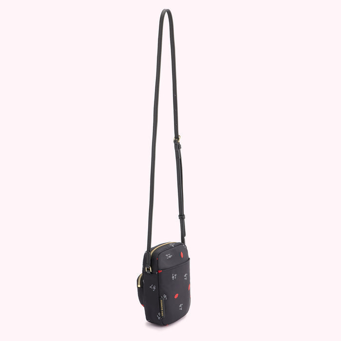Black crossbody bag with red lips and white lettering print on a white background.