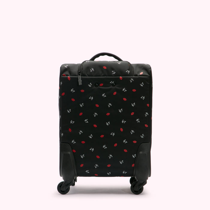 Black carry-on suitcase with a red lips print on a white background.