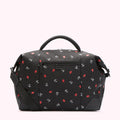 Black bag with red lips and white lettering pattern, black shoulder strap.