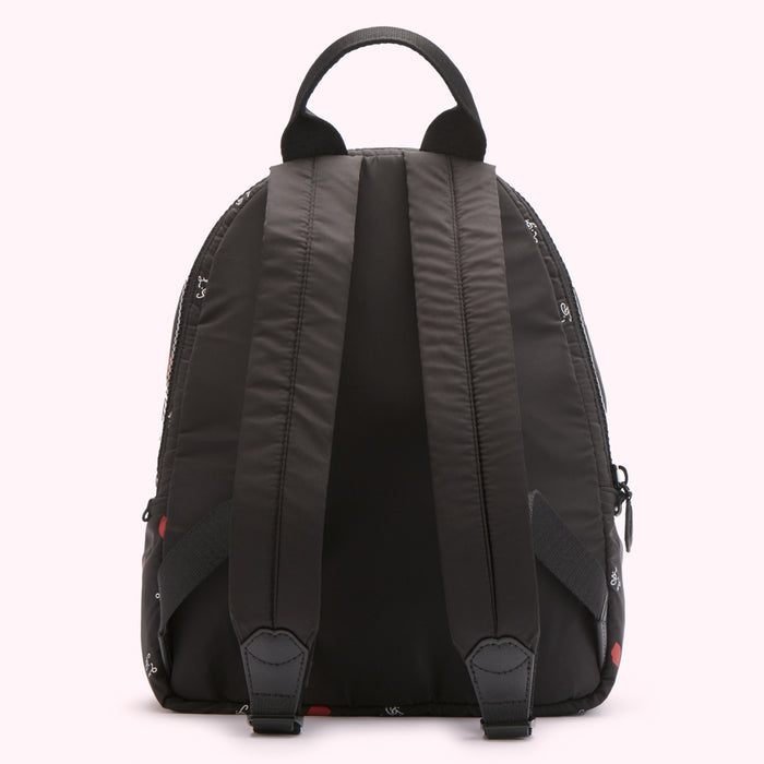 Black backpack with red and white print on a white background.