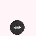 Black round compact mirror with silver lip design.