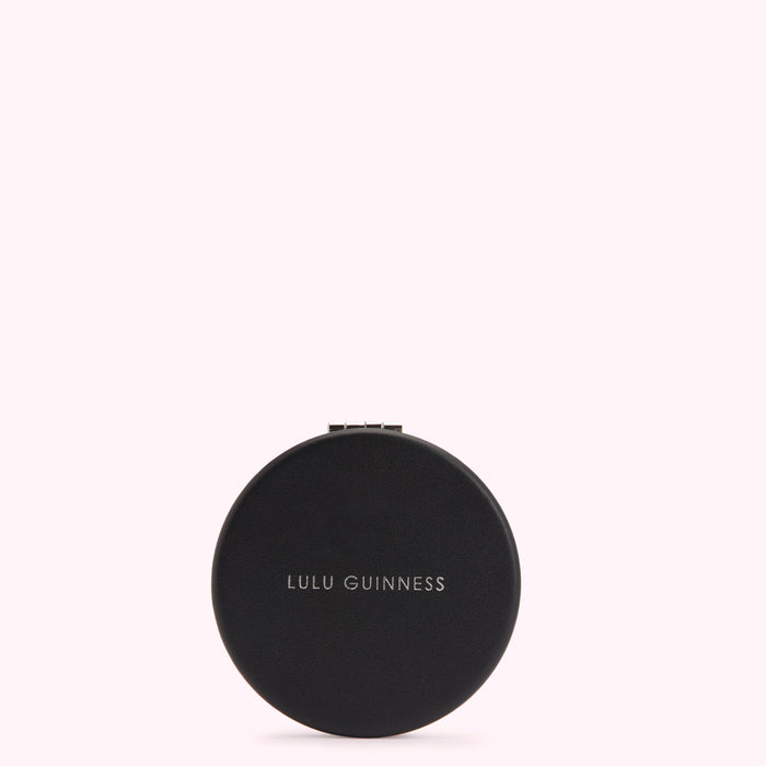 Black round compact mirror by Lulu Guinness.