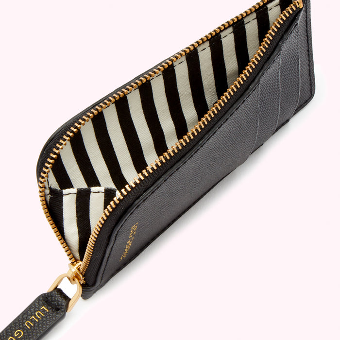 Black zip-around cardholder with black and white striped interior.