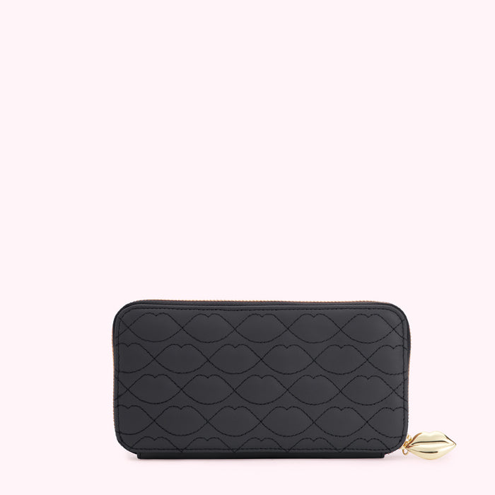 Black quilted zip-around wallet with lip pattern and gold lip charm.