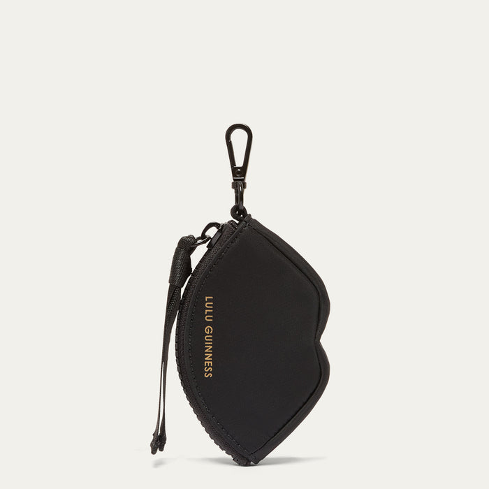 Black keychain pouch with a visible brand logo on a light grey background