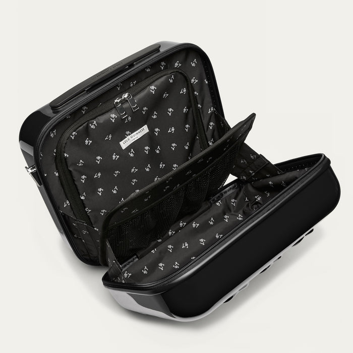 Black vanity case open with a LG printed lining on a light gray background