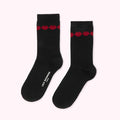 Pair of black Lulu Guinness socks with red glitter lips detail.