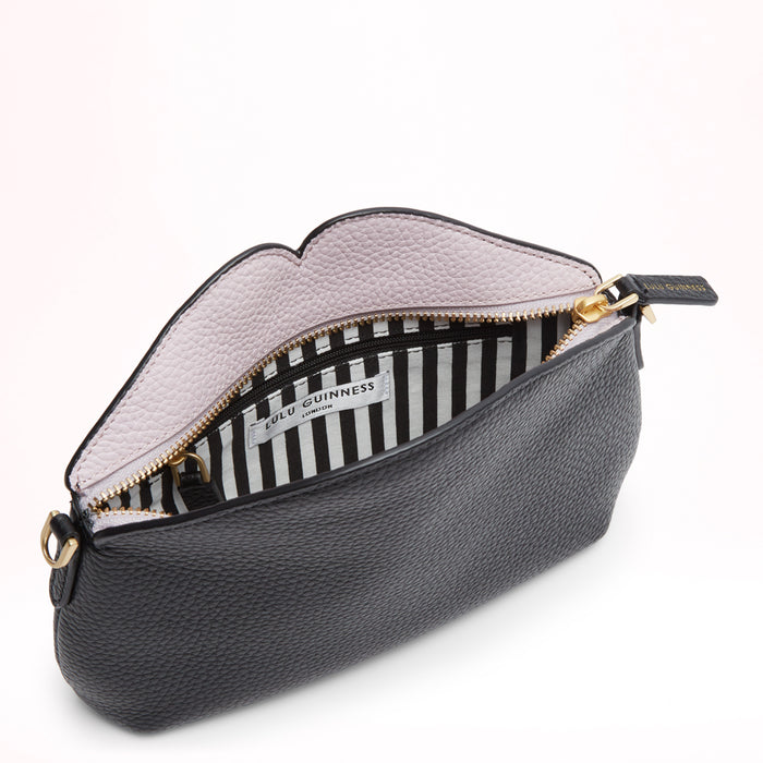 Open black Lulu Guinness crossbody bag with a light purple interior and black and white striped lining.