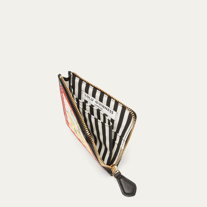Inside image of a coin purse revealing a striped lining on a light grey background.