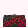 Black cosmetic bag with red lips print.