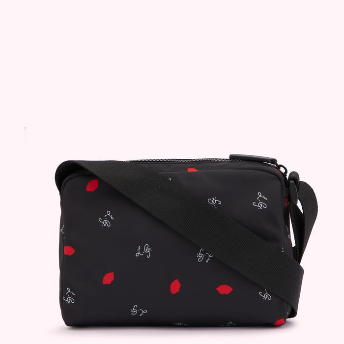 Black crossbody bag with red lips and LG logo pattern.