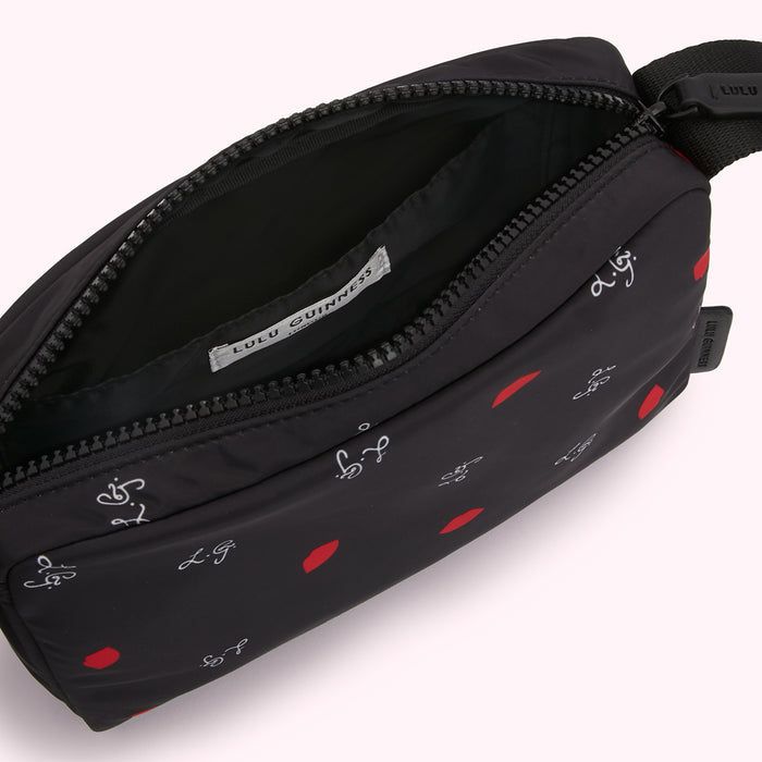 Black Lulu Guinness zipped pouch with red lips and white 'LG' logo print.