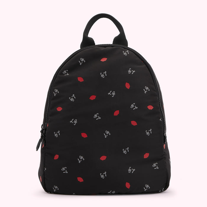 Black backpack with a red lip and white L.G. logo pattern.