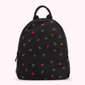 Black backpack with a red lip and white L.G. logo pattern.