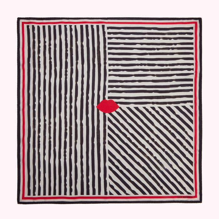 A cream-colored square scarf with a black and white striped pattern, featuring a single red lip in the centre. The scarf has a red border.