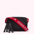 Black crossbody bag with red and white Lulu Guinness branded strap.