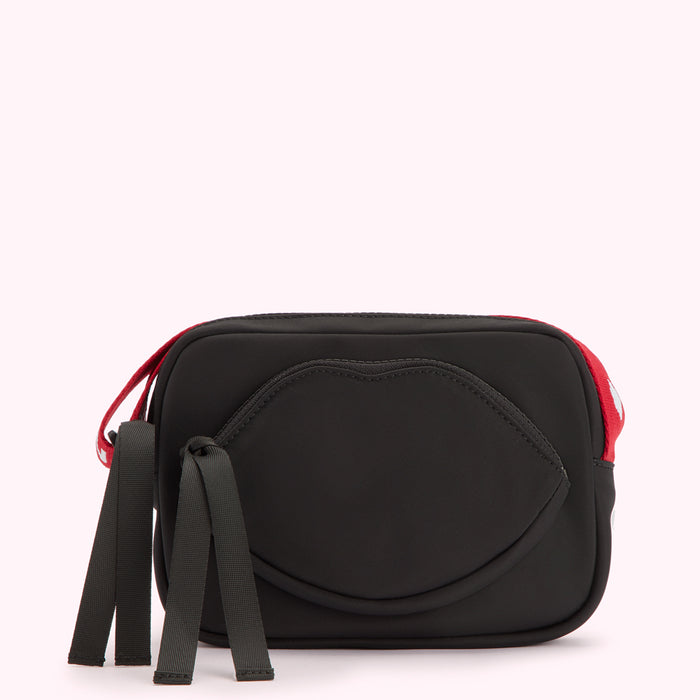 Black crossbody bag with a lip-shaped design and red accents.