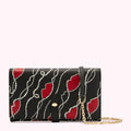 Black leather wallet with red lips and pearl details, gold chain strap.