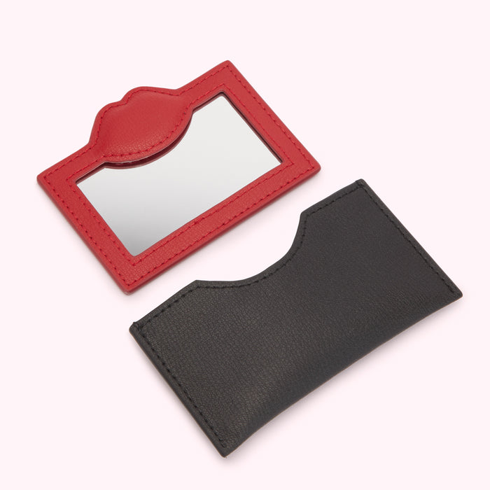 Red and black leather compact mirrors.