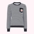 Black and white striped long-sleeved top with a small flower detail on the pocket.