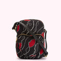 Black crossbody bag with red lips and pearl pattern.