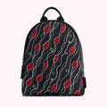Black backpack with red lips and white pearls pattern.