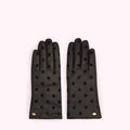 Pair of black leather gloves with black polka dots and a small gold lip detail.