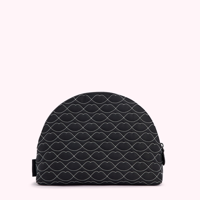 Black quilted makeup bag with a white lip print.