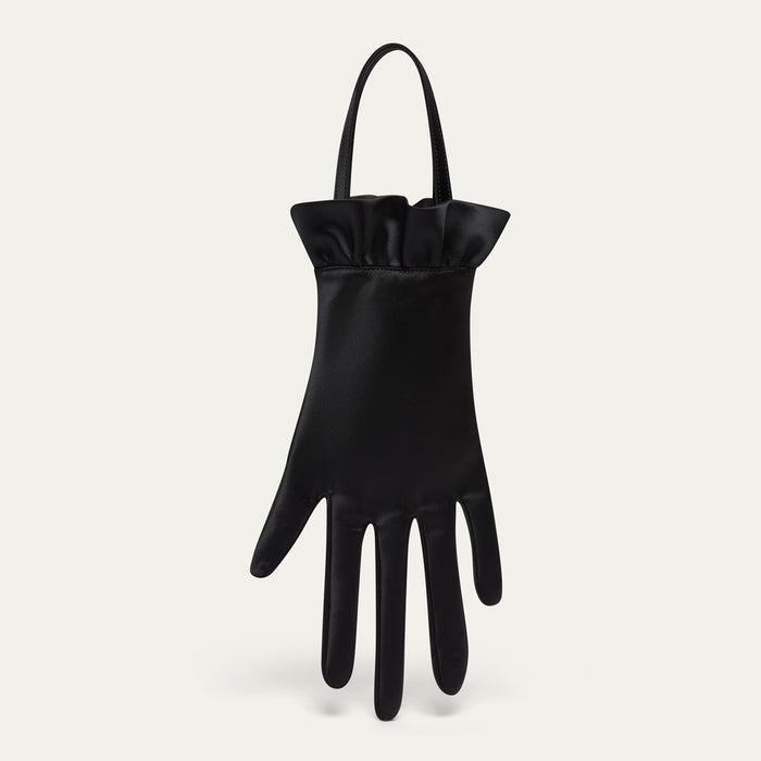 Black satin hand-shaped bag with ruffled cuff on a light gray background