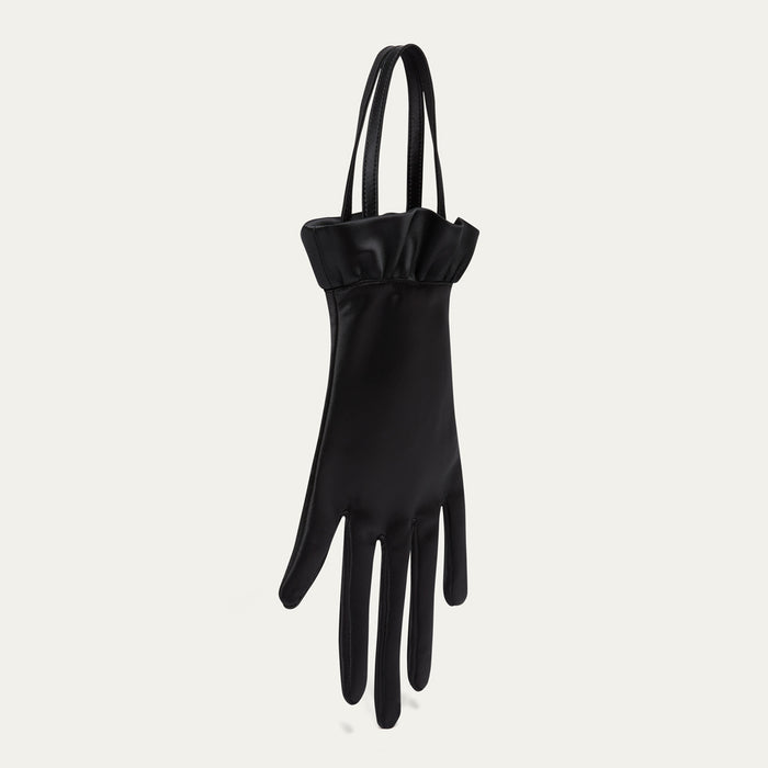 Black satin hand-shaped bag on a light gray background