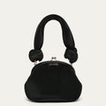 Black pleated satin handbag with knotted handles on a light gray background