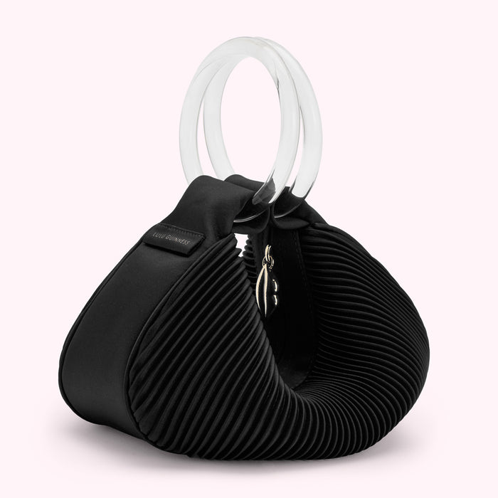 Black pleated satin Lulu Guinness handbag with clear acrylic top handle.
