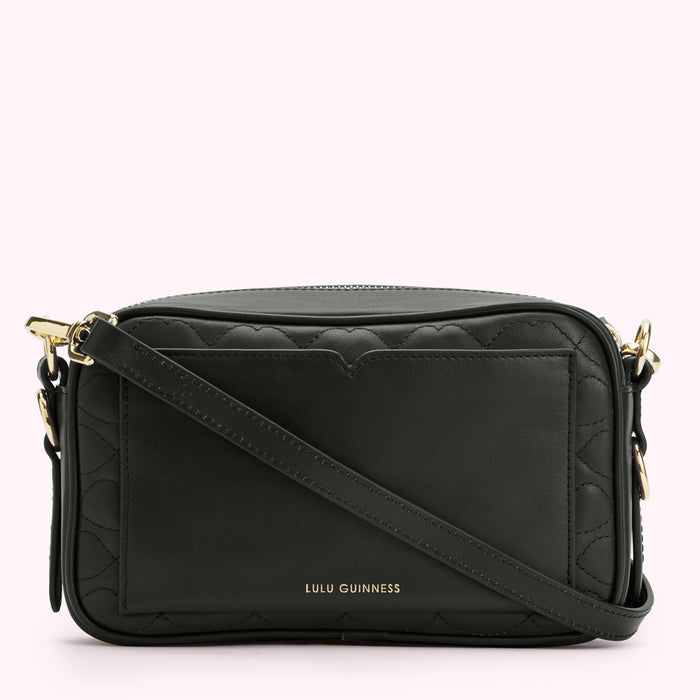 Black quilted crossbody bag with gold hardware and Lulu Guinness logo.