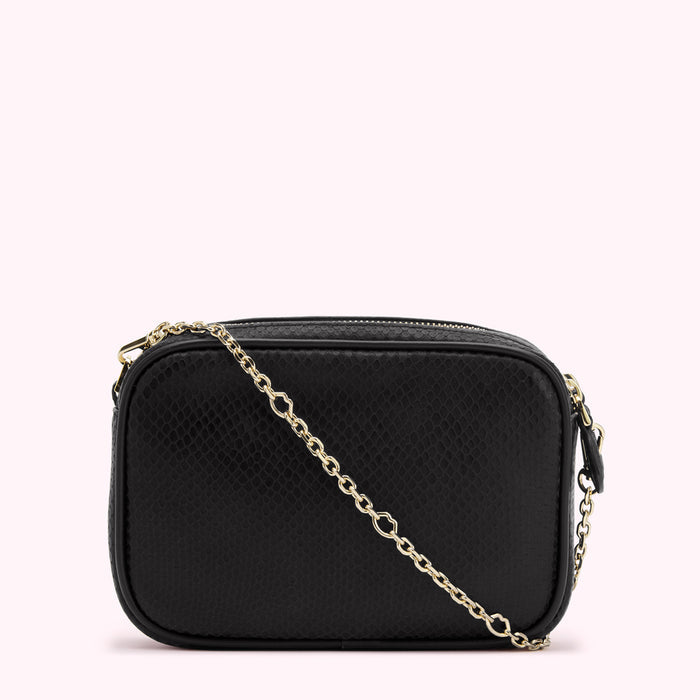 Black rectangular crossbody bag with gold chain strap and snakeskin pattern.