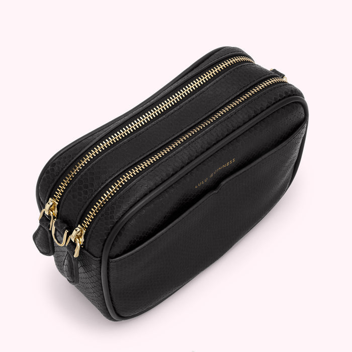 Black Lulu Guinness crossbody bag with gold zippers.