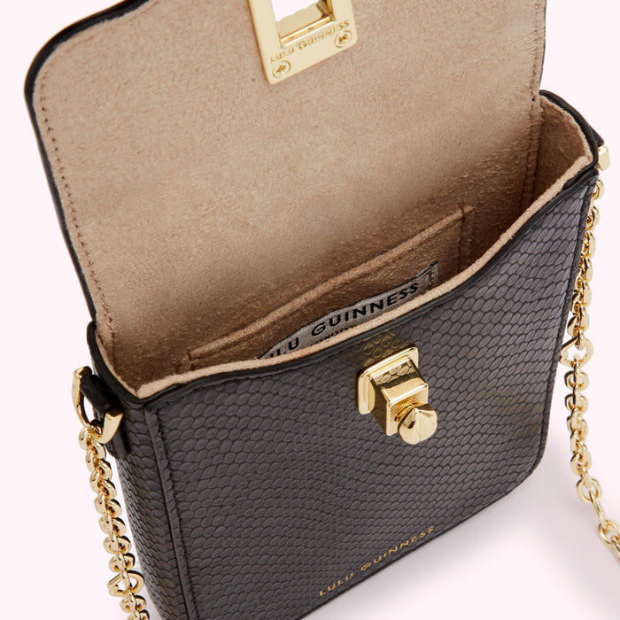 Open black Lulu Guinness crossbody bag with gold chain strap and clasp.