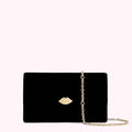 Black velvet clutch with gold lip detail and chain strap.